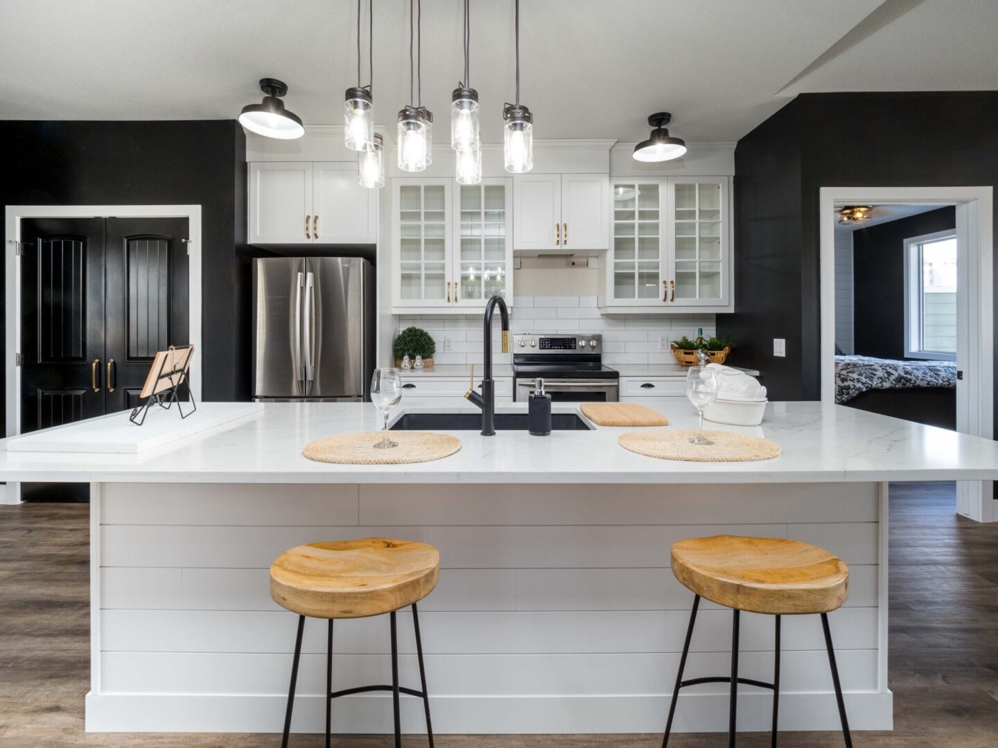Modern kitchen design with island and stools.